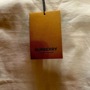 Beautiful white shirt with Burberry print on back of shirt. Brand New
